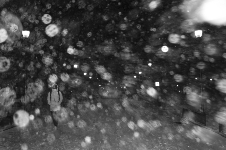 A pedestrian walks along Locust Walk on the University of Pennsylvania campus during a snowstorm in Philadelphia, Pa. on Jan. 31, 2021.