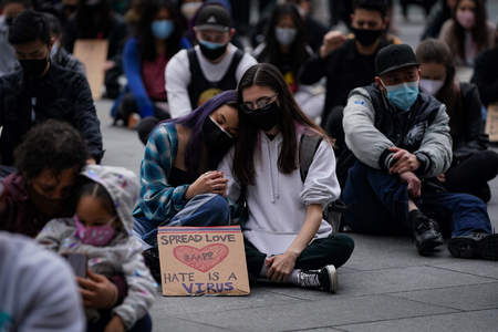 Krista Temcharoen (left), a student at Drexel University, and her girlfriend comfort each other during a moment of silence at a Philly Rally for Solidarity in response to a series of shootings in Atlanta, Ga. that killed eight people, including six Asian women, in Philadelphia, Pa. on March 25, 2021.