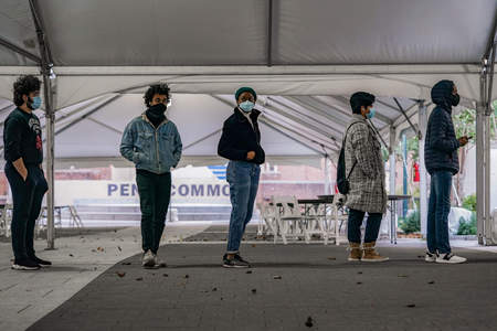 Students at the University of Pennsylvania wait in line to vote just prior to the opening of the polls at 8 a.m. EDT in Philadelphia, Pa. on Nov. 3, 2020.