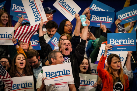 Supporters of Sen. Bernie Sanders (I-Vt.) cheer during a primary night event on the night of the New Hampshire Democratic primary election in Manchester, N.H. on Feb. 11, 2020.