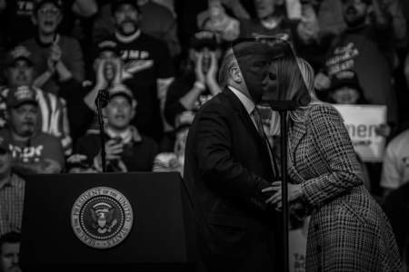 President Donald Trump and his daughter, Ivanka Trump, kiss each other on the cheek during a campaign rally in Manchester, N.H. on Feb. 10, 2020.