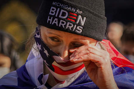 Liane Kufchok from Michigan wipes away a tear during President Joe Biden's inaugural address at Black Lives Matter Plaza in Washington, D.C. on Jan. 20, 2021. 