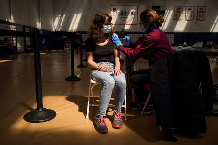 University of Pennsylvania senior Laura Beck receives her first dose of the Pfizer COVID-19 vaccine at Gimbel Gymnasium in Philadelphia, Pa. on April 21, 2021.