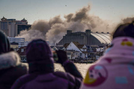 People watch the demolition of the Trump Plaza Hotel and Casino in Atlantic City, N.J. on Feb. 17, 2021.