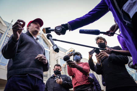 A supporter of President Donald Trump speaks to the media outside the Pennsylvania Convention Center in Philadelphia, Pa. on Nov. 4, 2020. President Trump's legal team was scheduled to hold a press conference outside the convention center, but it was abruptly canceled soon after it was announced.