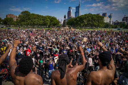 Demonstrators raise their fists in solidarity with the Black Lives Matter movement during a protest to end police brutality and systemic racism in response to the killing of George Floyd at the Philadelphia Museum of Art in Philadelphia, Pa. on June 3, 2020.