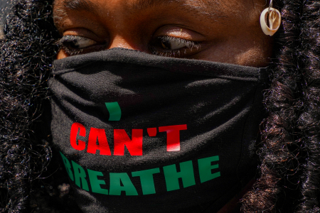 A woman is seen wearing a mask with the final words of George Floyd before he was killed by Minneapolis Police officer Derek Chauvin during a protest at Philadelphia City Hall in Philadelphia, Pa. on May 30, 2020. 