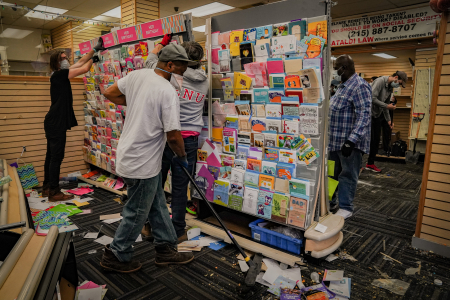 West Philadelphia residents and local business owners clean up SunRay Drugs on 52nd and Walnut Streets on the morning of June 1, 2020 after the store was looted the night before.