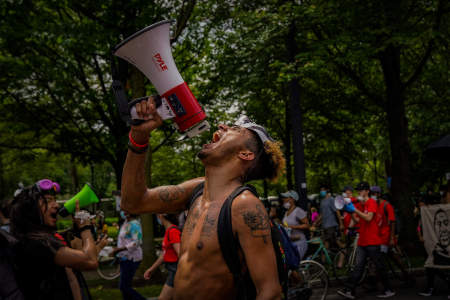 A protester screams a chant into a megaphone on the Benjamin Franklin Parkway in Philadelphia, Pa. on June 6, 2020.