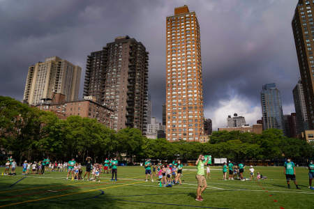 The 19 different camp groups line up in socially distant pods on Litwin Field during morning assembly on July 15, 2020.