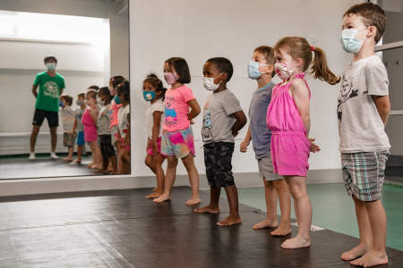 Campers in the four to five-year-old division stand at attention during martial arts on July 20, 2020. 