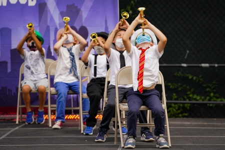 Campers in the seven to eight-year-old division perform during the second camp talent show, which included performances from the three oldest divisions, on July 30, 2020. In acts that included campers from more than one individual group, campers were required to wear masks while performing.