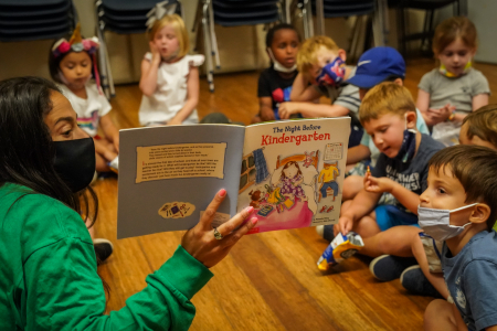Sindy Weisinger, the four to five-year-old division leader, reads "The Night Before Kindergarten" to a group on the second-to-last day of camp on Aug. 20, 2020. As the camp session drew to a close, the status of in-person learning in New York City public schools remained uncertain.