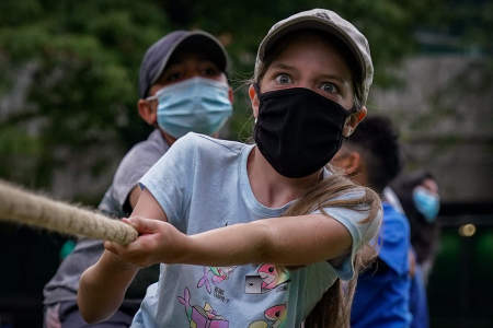 As a part of Color War festivities, campers compete in a large tug of war on Aug. 13, 2020. During Color War, the camp splits into two teams for a week and the campers compete during group activities and special challenges to determine a winner.