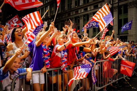 Fans cheer along Broadway as the floats carrying the U.S. women's soccer team drive by during a ticker tape parade to celebrate their FIFA Women's World Cup victory along Broadway's Canyon of Heroes in New York, N.Y. on July 10, 2019.