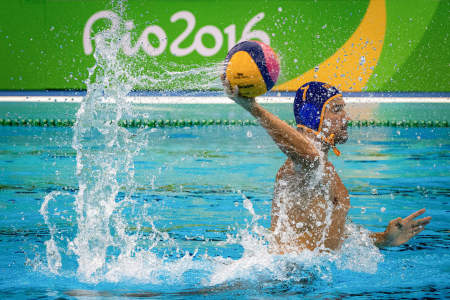 Mladan Janovic of Montenegro attempts a shot during the men's water polo quarterfinal match against Hungary in Rio de Janeiro, Brazil on Aug. 16, 2016.