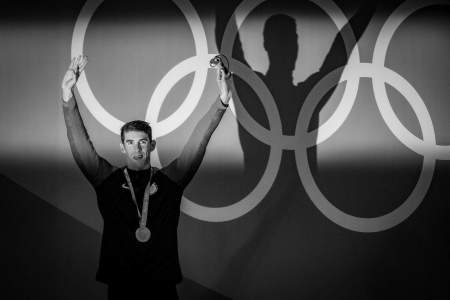 Michael Phelps of the United States waves to the crowd after winning gold in the men's 200m butterfly final at the Olympic Aquatics Stadium in Rio de Janerio, Brazil on Aug. 9, 2016.