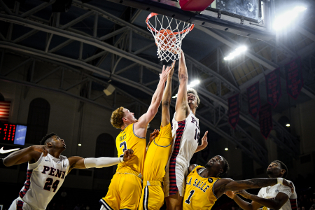 Freshman forward Max Martz (center right) attempts to tip in a missed shot during a game against the La Salle Explorers at the Palestra in Philadelphia, Pa. on Nov. 13, 2019.