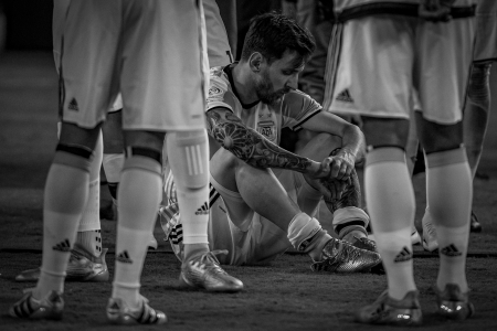 Argentina's Lionel Messi sits while waiting for the trophy presentations after losing the Copa America Centenario soccer final at Metlife Stadium in East Rutherford, N.J. on June 26, 2016.