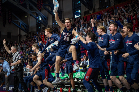 University of Pennsylvania guard Matt MacDonald celebrates on the bench after a made three-pointer during the men's Ivy League Tournament championship basketball game against the Harvard Crimson at the Palestra in Philadelphia, Pa. on March 11, 2018.