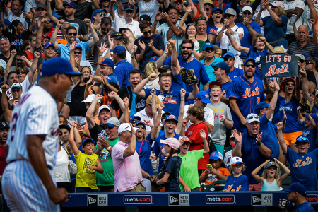 New York Mets fans cheer after closer Jeurys Familia recorded the final out of a victory over the Boston Red Sox at Citi Field in Queens, N.Y. on Aug. 30, 2015.