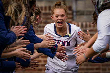 Alyson Feeley of the University of Pennsylvania high fives her teammates during the lineups announcement before a womens lacrosse game against La Salle University at Franklin Field in Philadelphia, Pa. on April 22, 2021.