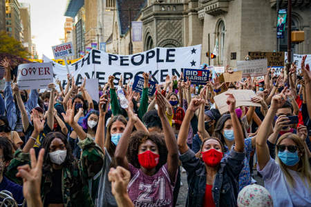 The crowd cheers during speeches given outside the City Hall building as the celebrations of Joe Biden's election victory continue in Philadelphia, Pa. on Nov. 7, 2020.