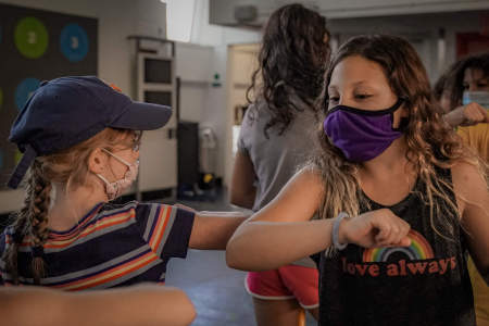 After a game of pillow hockey, campers in the nine to 13-year-old division elbow bump instead of high five to promote good sportsmanship and hygiene on Aug. 10, 2020. 