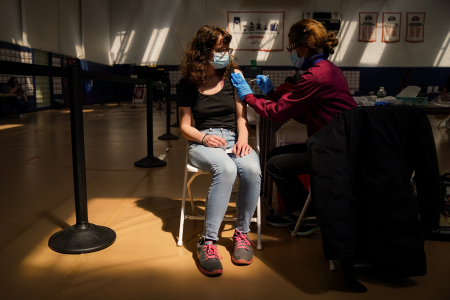 University of Pennsylvania senior Laura Beck receives her first dose of the Pfizer COVID-19 vaccine at Gimbel Gymnasium in Philadelphia, Pa. on April 21, 2021.