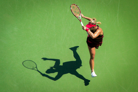 Angelique Kerber of Russia hits a forehand to Ksenia Pervak of Russia during the first round of the US Open tennis tournament in Queens, N.Y. on Aug. 25, 2014. 