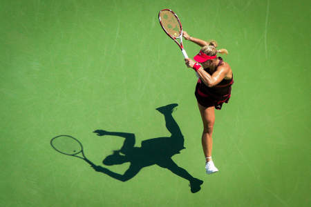 Angelique Kerber of Russia hits a forehand to Ksenia Pervak of Russia during the first round of the US Open tennis tournament in Queens, N.Y. on Aug. 25, 2014. 