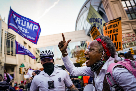A Count Every Vote demonstrator argues with Trump supporters outside the Pennsylvania Convention Center in Philadelphia, Pa. on Nov. 7, 2020.
